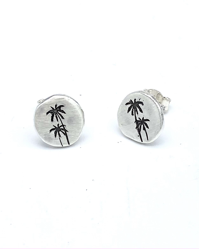 BETWEEN STEEPING PALM TREES